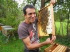 António Couto, BeeAlive Academy trainer, next to his beehives